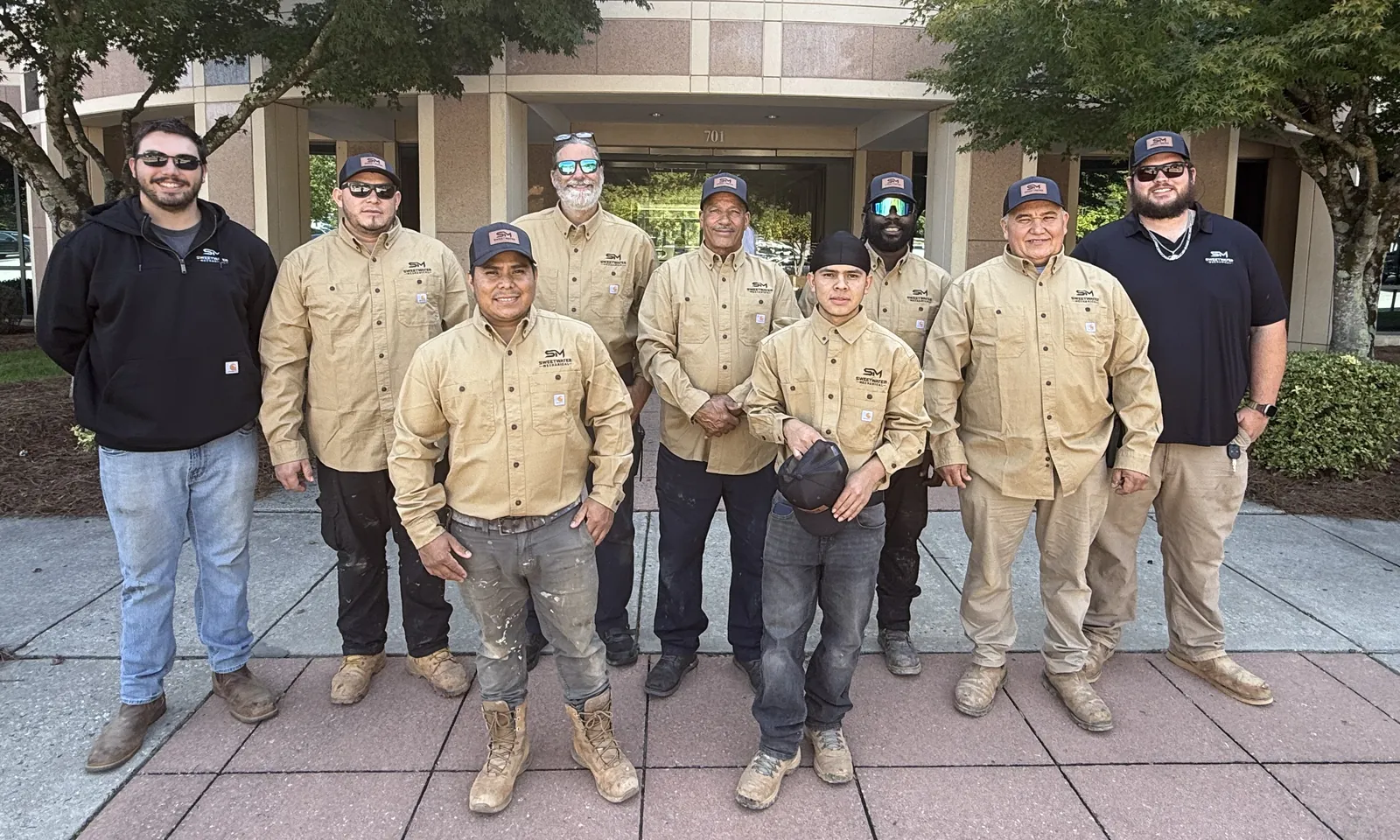 The Sweetwater Mechanical crew in company shirts and hats